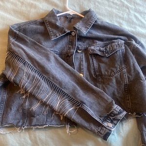 Women’s cropped black jean jacket with fringe sleeves